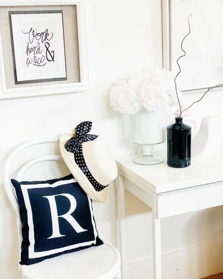 White Console Table With Black Decorative Vessel