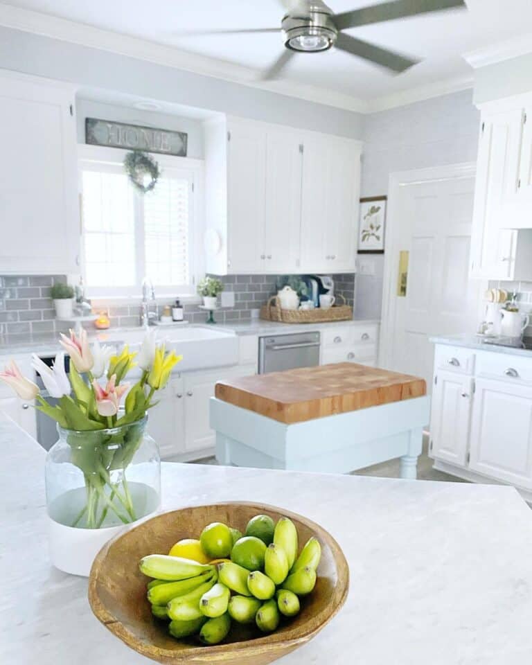 White Farmhouse Kitchen with Small Butcher Block Table