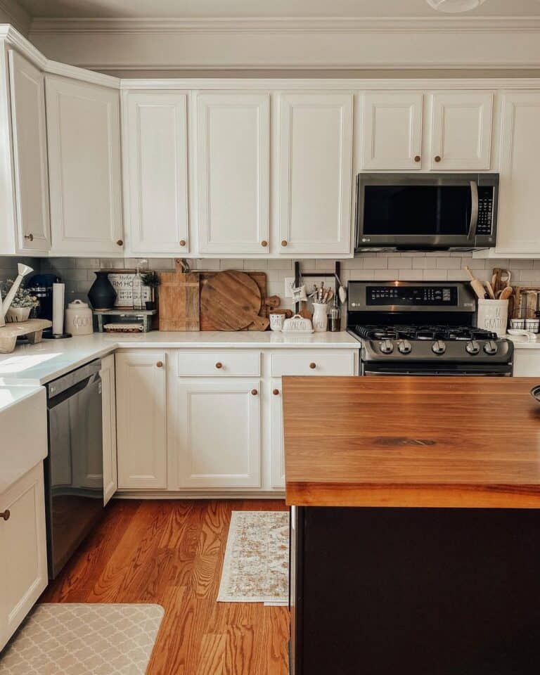Black Butcher Block Island in a White Farmhouse Kitchen
