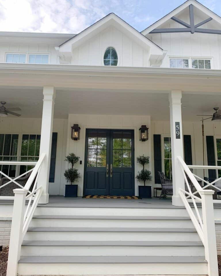 Large Front Porch With White and Gray Steps