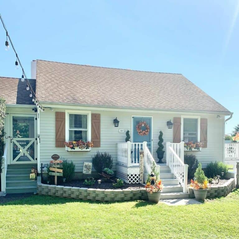 Small Cottage With Welcoming Gray Front Steps