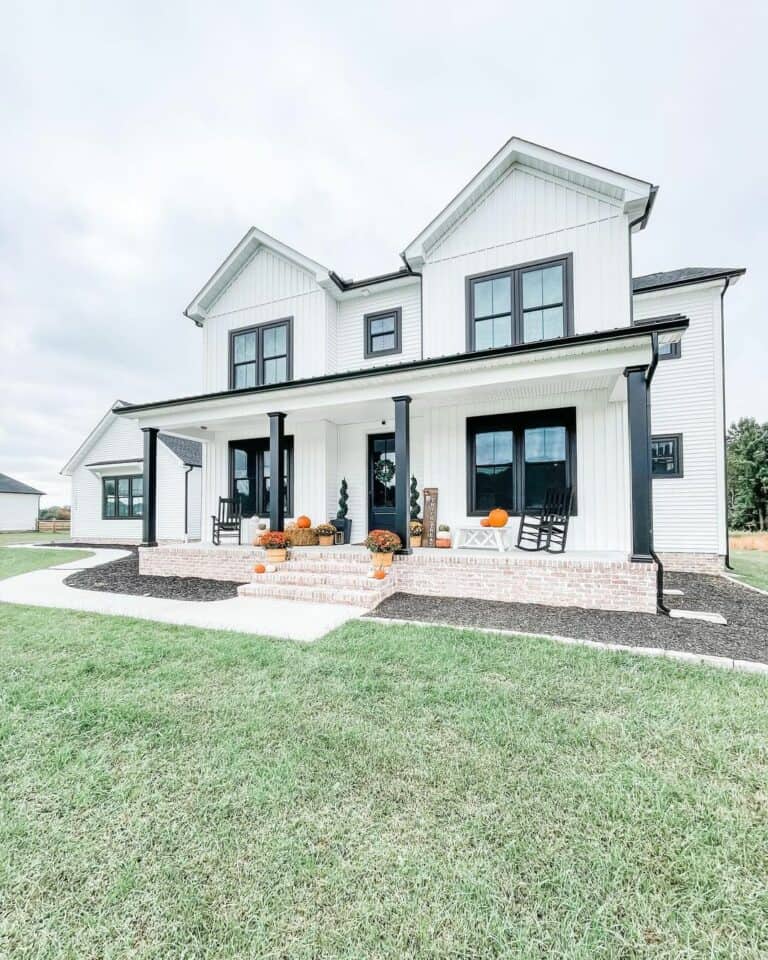 Modern White and Black Porch With Red Brick Front Steps