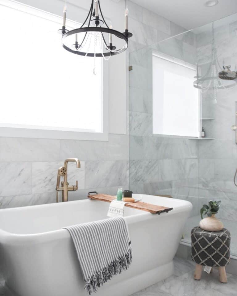 Black Candle Chandelier Above a Large Tub