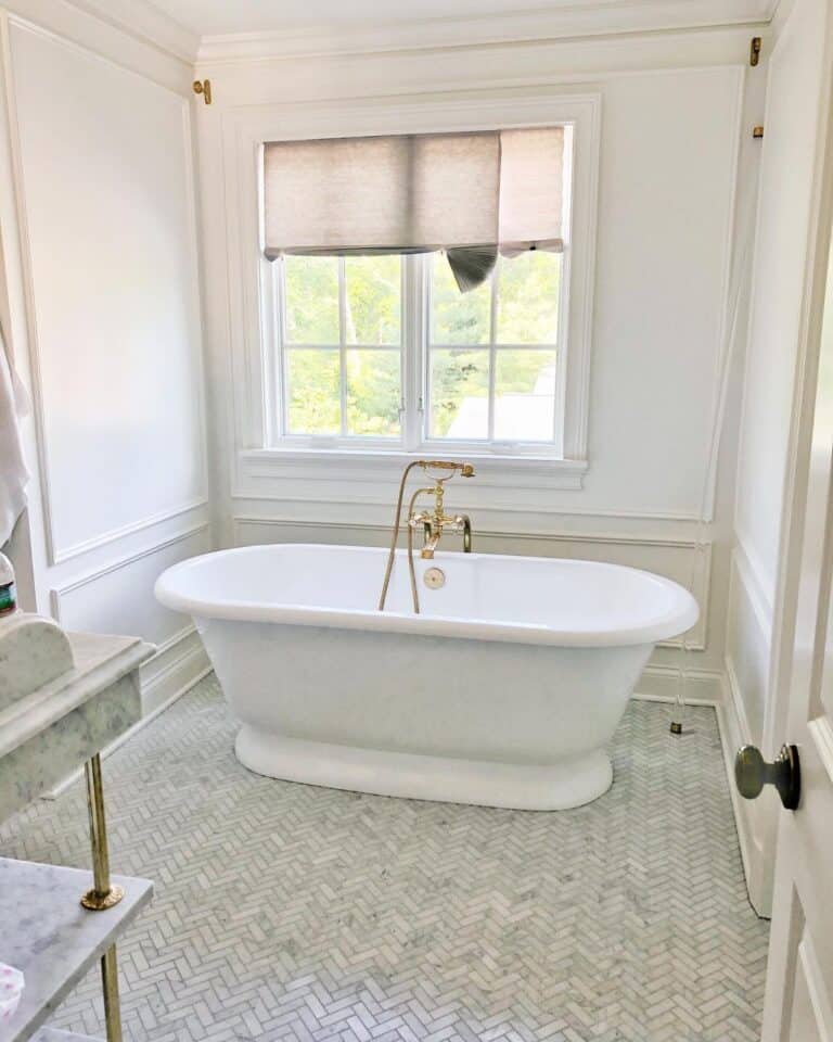 Wainscotting and Herringbone Tiled Bathroom