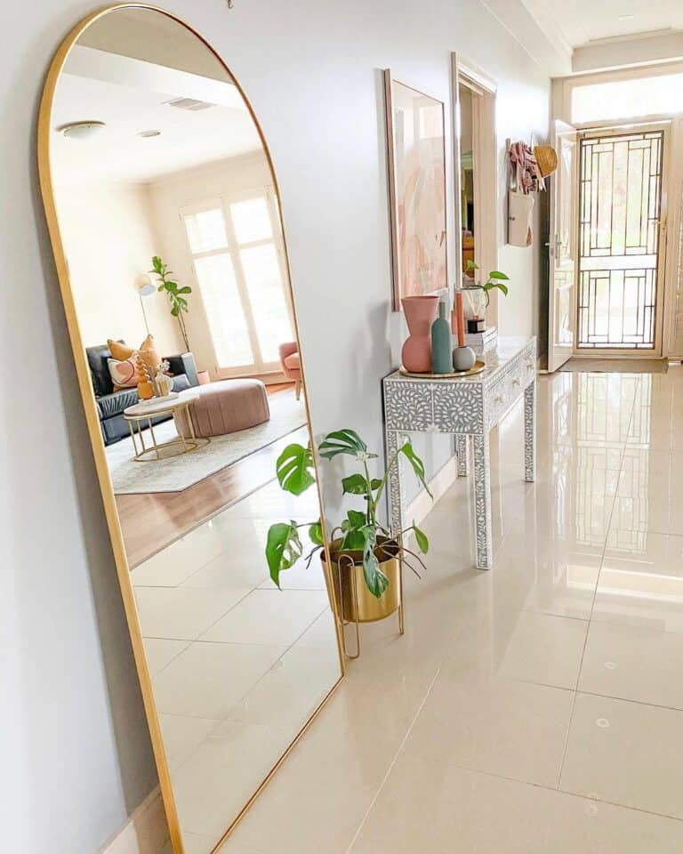 Arched Mirror Leans Against One Wall