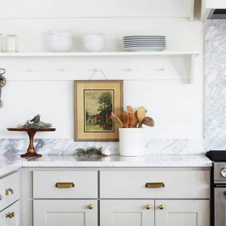 Aged Brass Hardware on Light Gray Cabinets