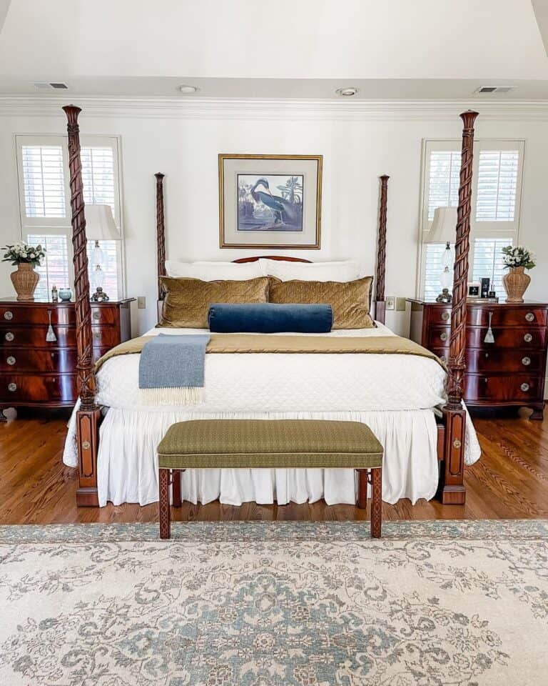 Four Poster Bed with Gold Velvet Accent Pillows
