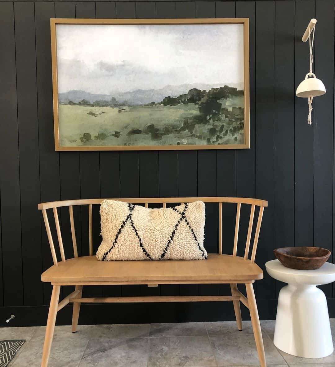 Large Framed Print Hanging on Black Shiplap Wall