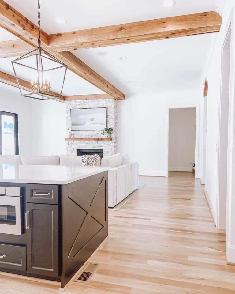 Open Living Area With Recessed Lights and Exposed Beams