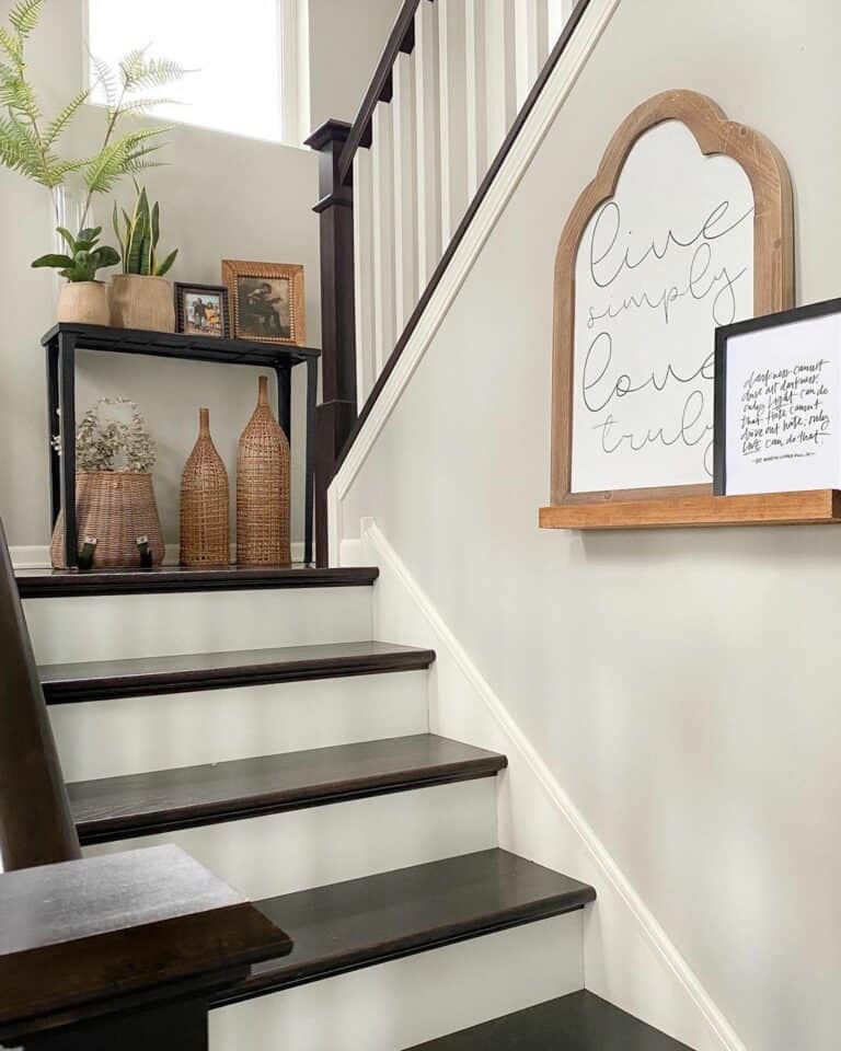 Sleek Black Accent Décor for a Dark Wood Stairwell