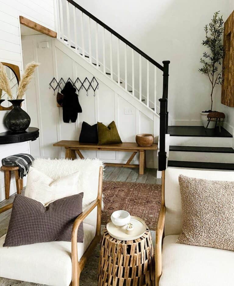 Black and White Stairwell With Simple Wall Art and Indoor Plants