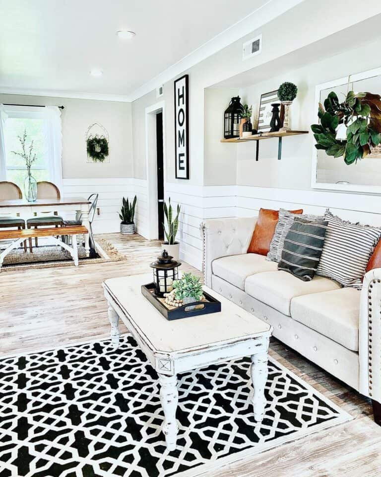 Open Great Room With Black and White Area Rug