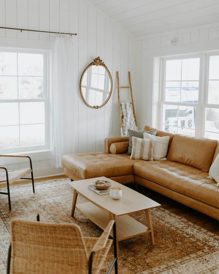 Living Room with Vertical Shiplap and a Tufted Brown Leather Couch
