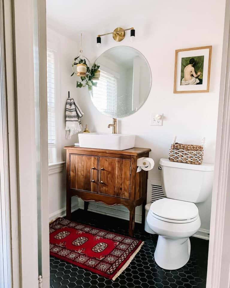 Bathroom with Black and Gold Light Fixture