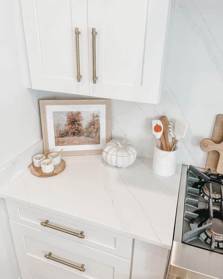 Long Brass Kitchen Handles on White Shaker Cabinets