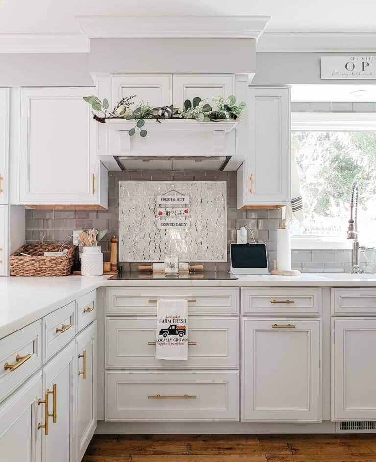 Long Brass Kitchen Pulls on White Cabinets