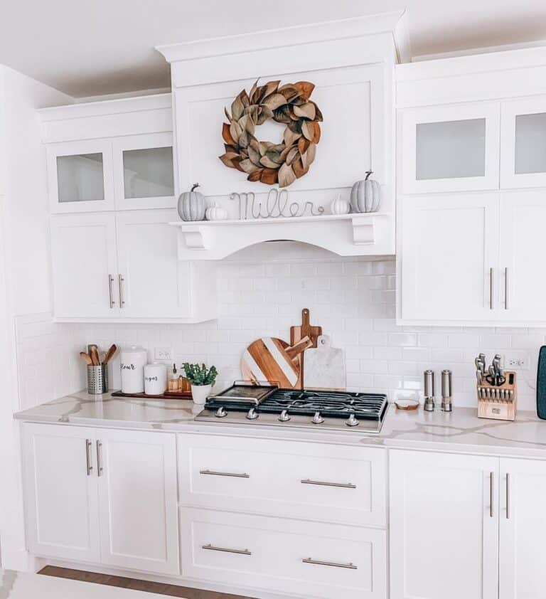 White Cabinet Doors with Long Brass Kitchen Pulls
