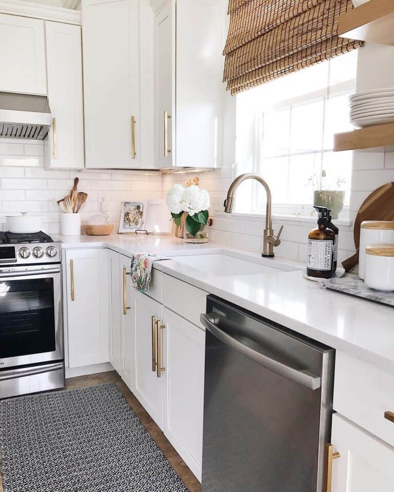 Long Vertical Brass Kitchen Pulls on White Cabinets