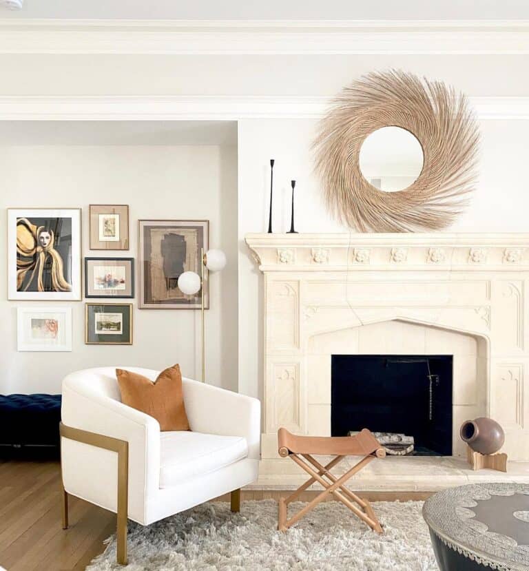 Gold Mirror Above an Intricate White Mantel