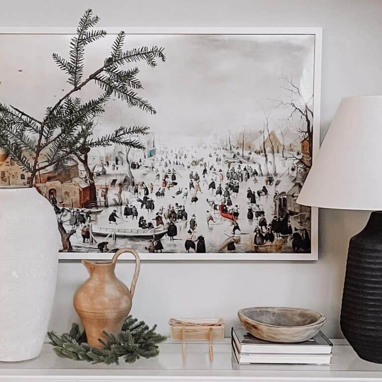 An Ice Skating Print Over Décor on a Glass Shelf