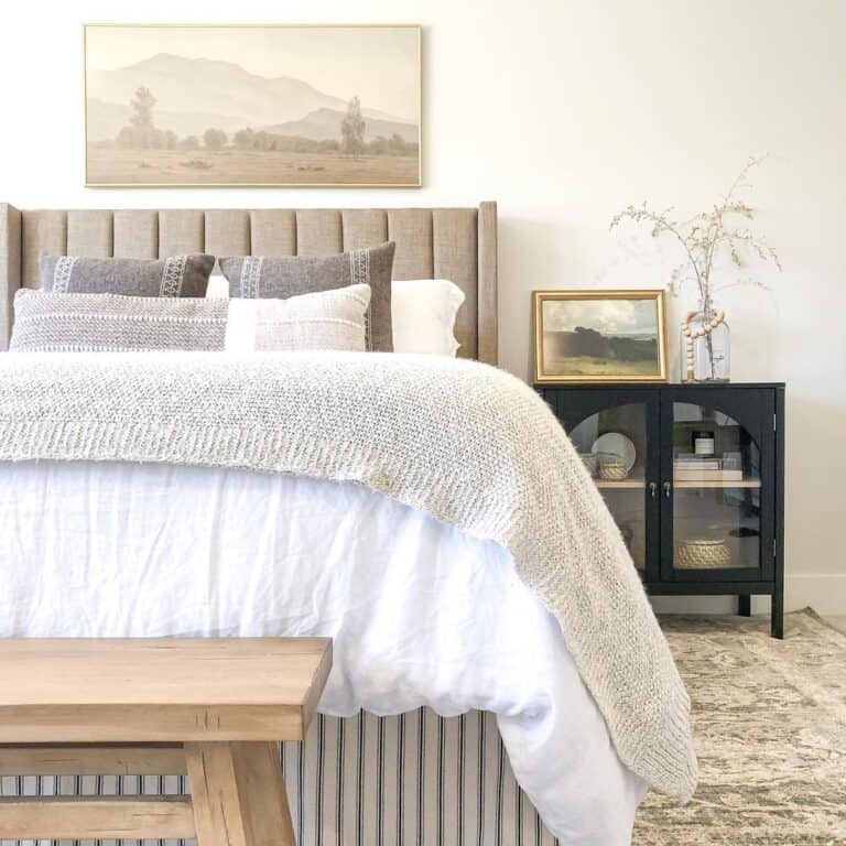 A Landscape Over a Beige Headboard