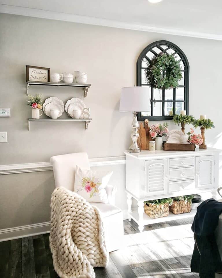 Dark Green Window Pane Decor Above a White Console Table