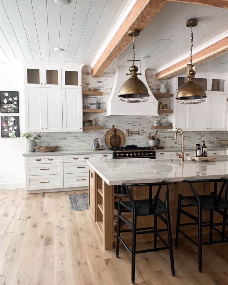 Wooden Kitchen Island Under Brass Pendant Lighting