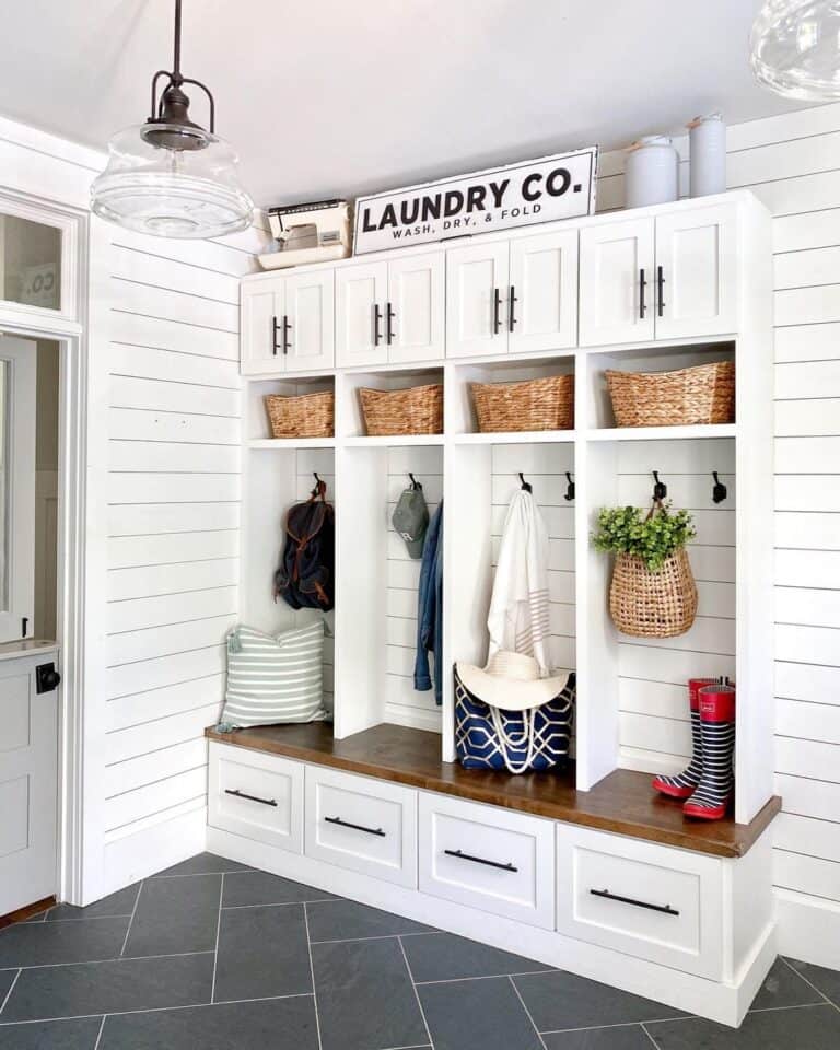 Mudroom with Black Herringbone Tile Floor