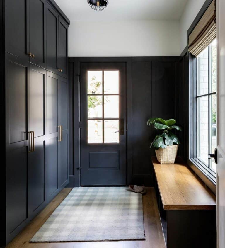 Elegant Black Mudroom Lockers with Gold Hardware