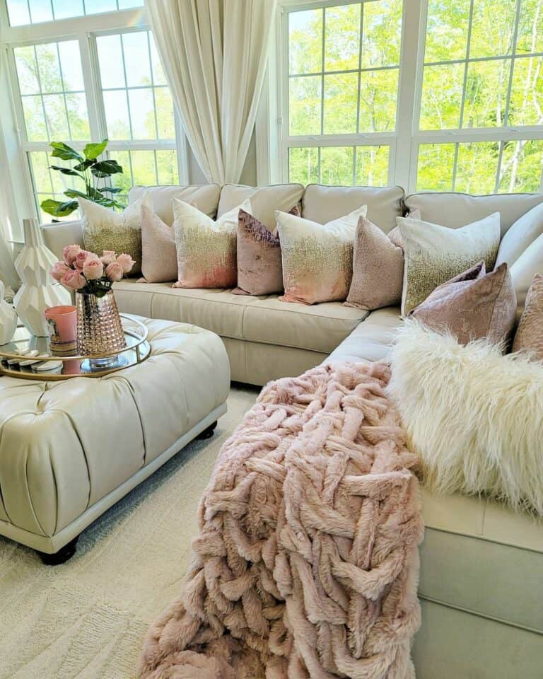 Beige Leather Sofa and Ottoman with Pink Centerpiece