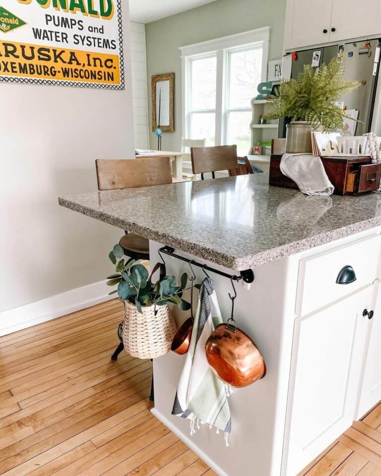 Copper Pots Hang off White Kitchen Island