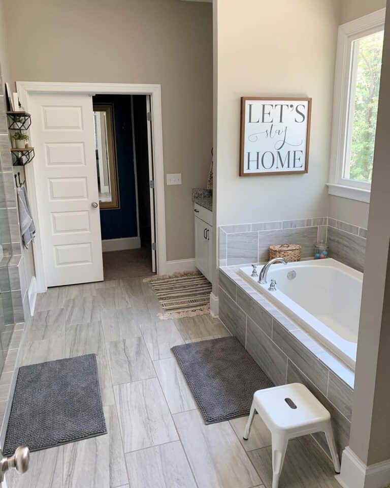 Light Gray Tile Surrounds Bathtub Alcove