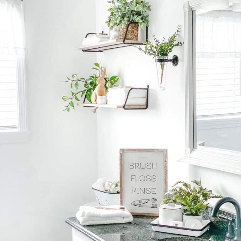 All-White Bathroom with Bursts of Greenery