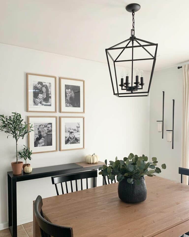 Black Chandelier Over a Light Wood Table