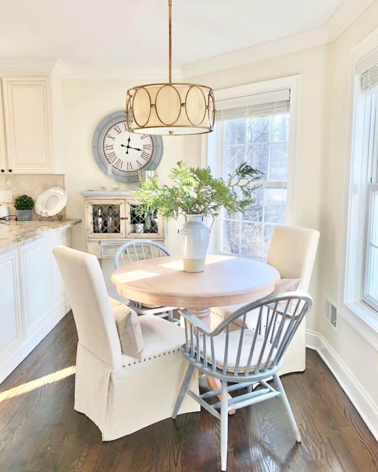Light Wood Kitchen Table with Brass Chandelier