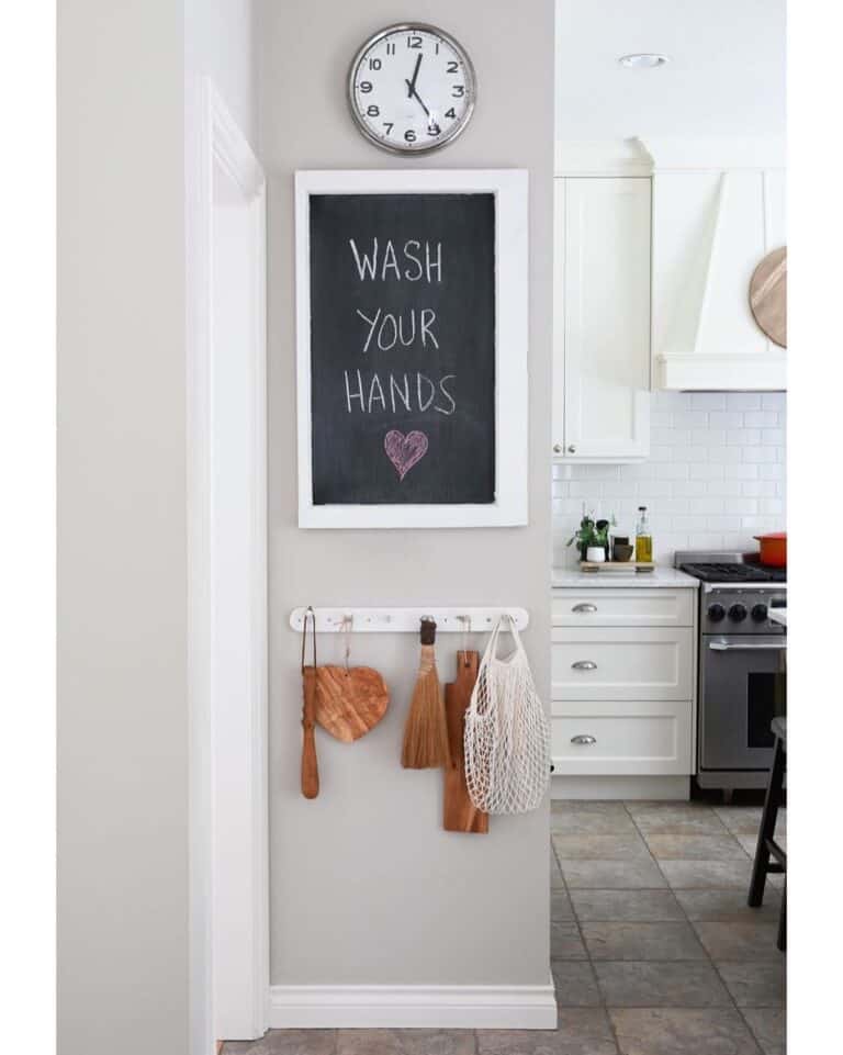 Metal Clock Above a Black Chalkboard Kitchen Sign