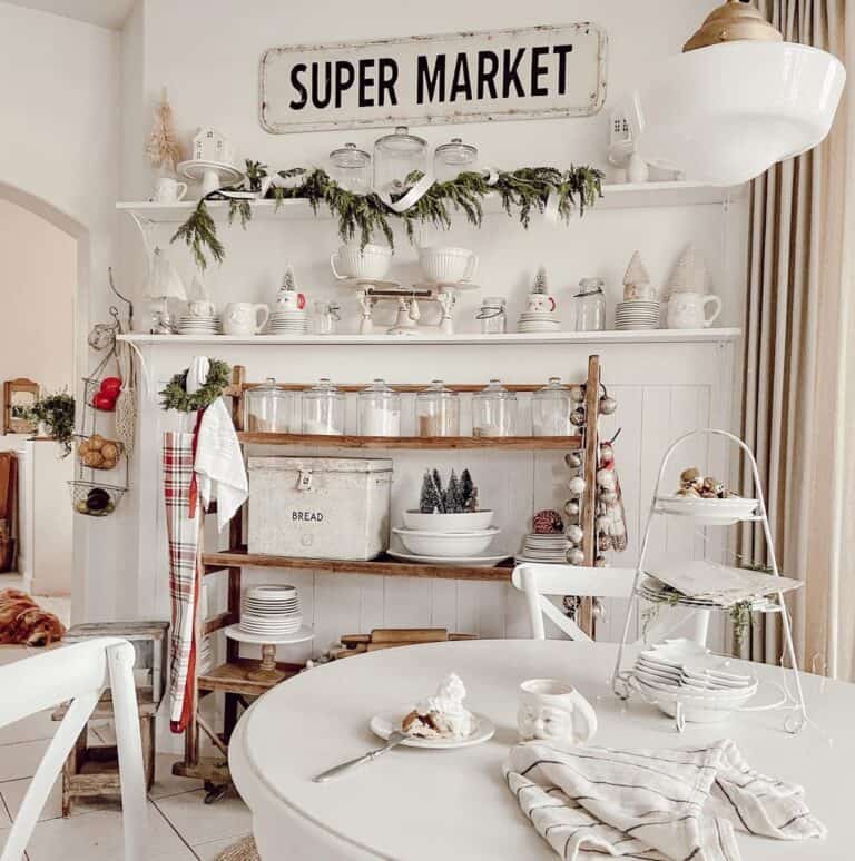White Farmhouse Kitchen Sign Over White Shelves
