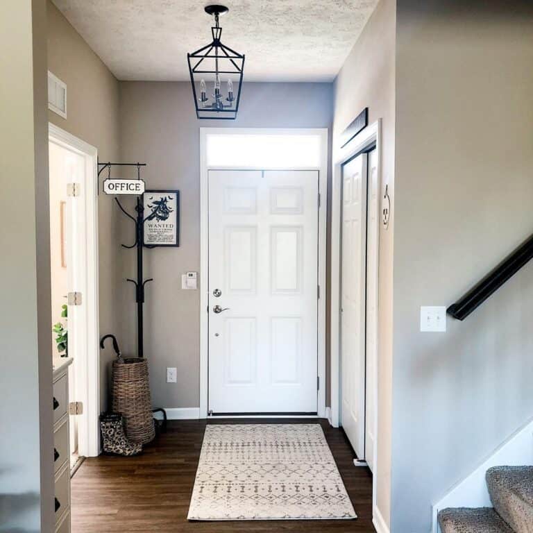 Black Lantern Light Fixture Over a White Rug