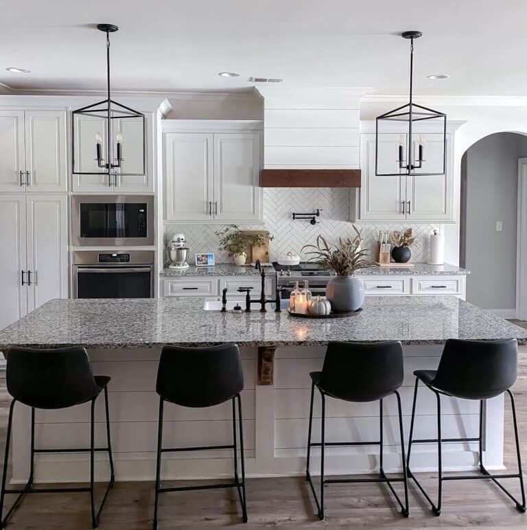 Black Kitchen Lantern Lights Over a Mottled Grey Counter