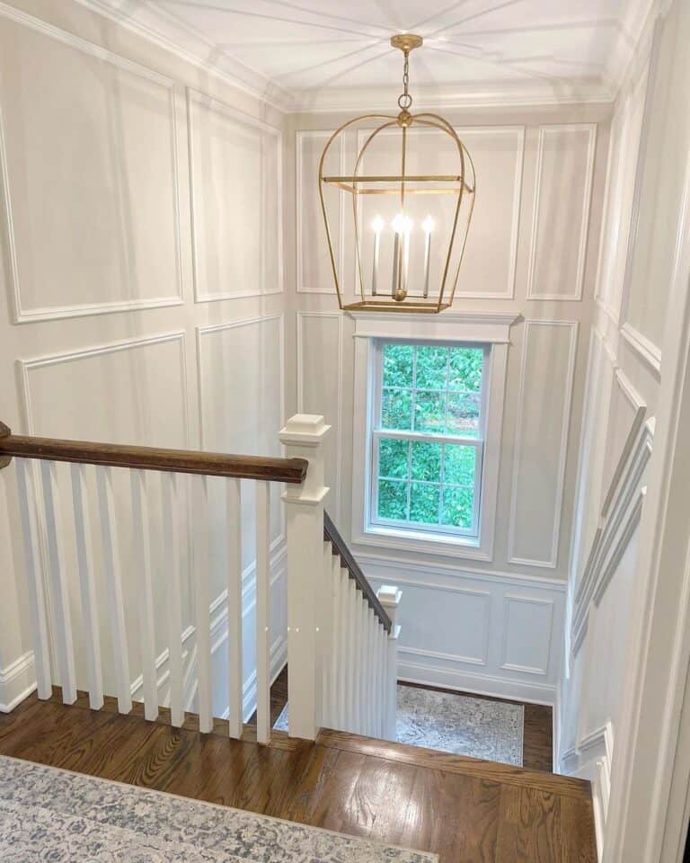 Gold Lantern Chandelier Over a Staircase