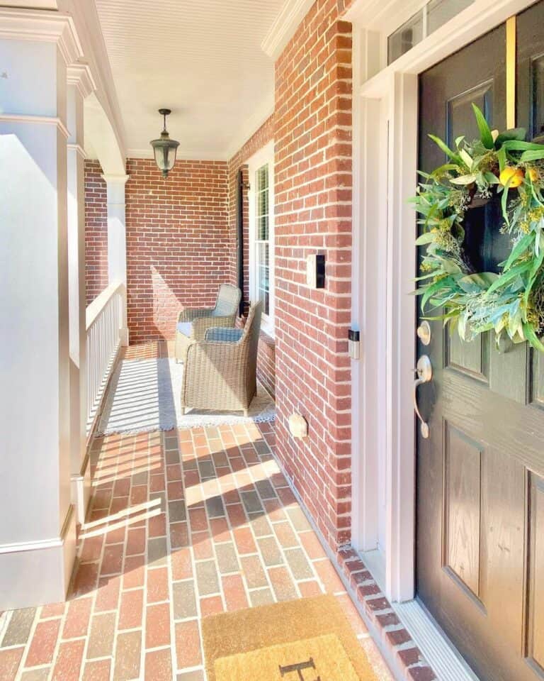 Farmhouse Brick Porch with White Railing