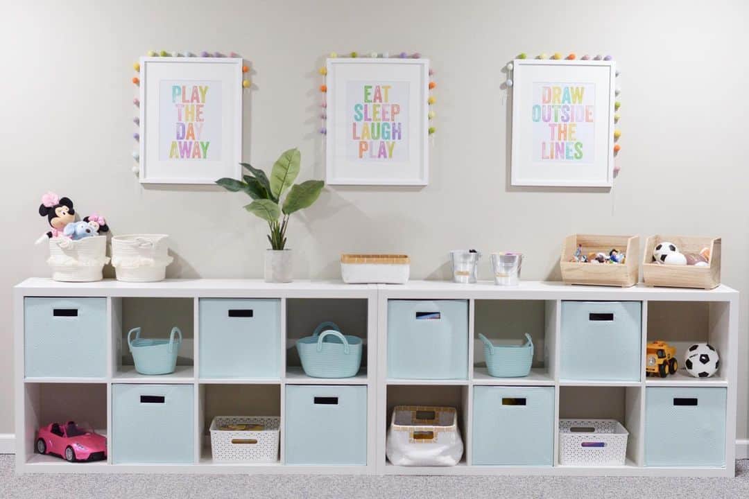 White Playroom Storage Cubes Under Colorful Signs