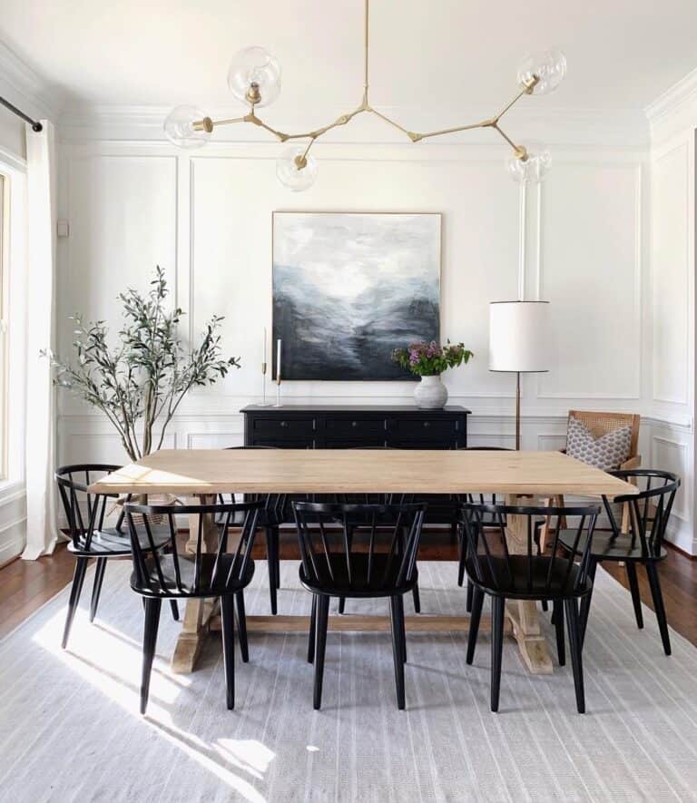 A Landscape Above a Black cabinet