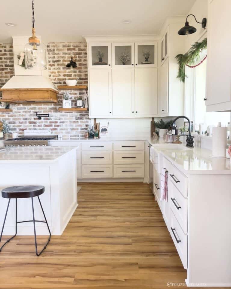 Kitchen with Brick Feature Wall and Light Wood Floor