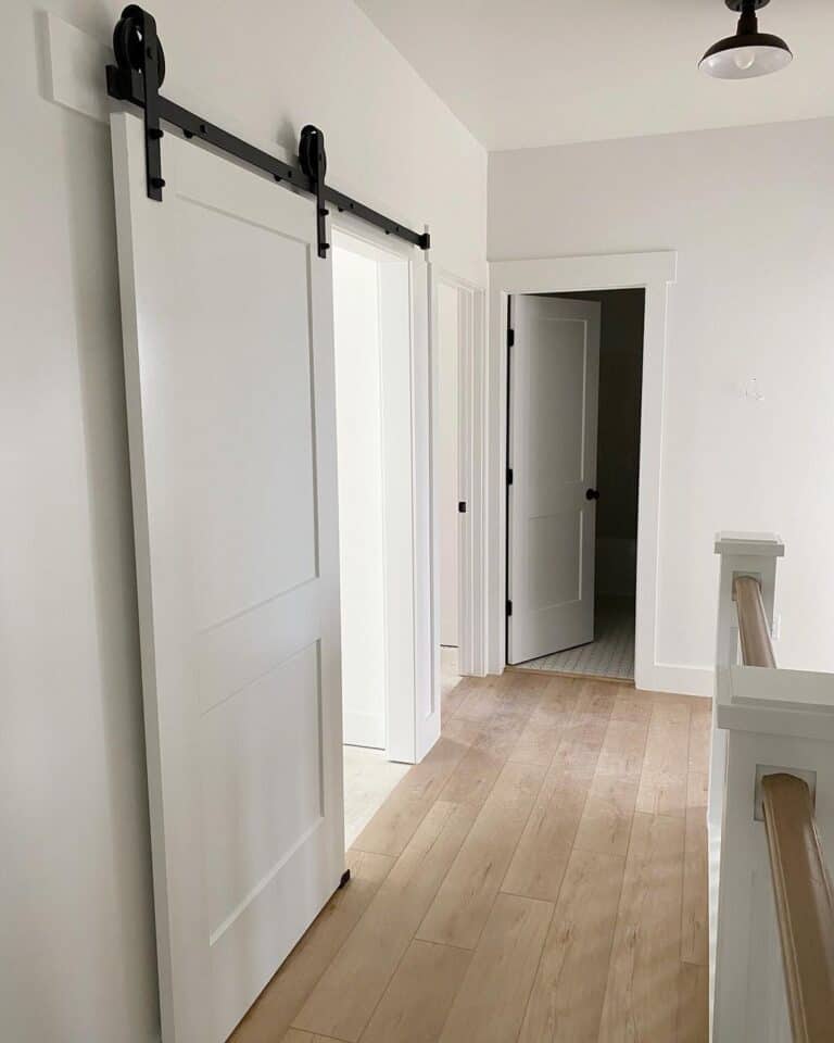 White Hallway with Light Wood Floor