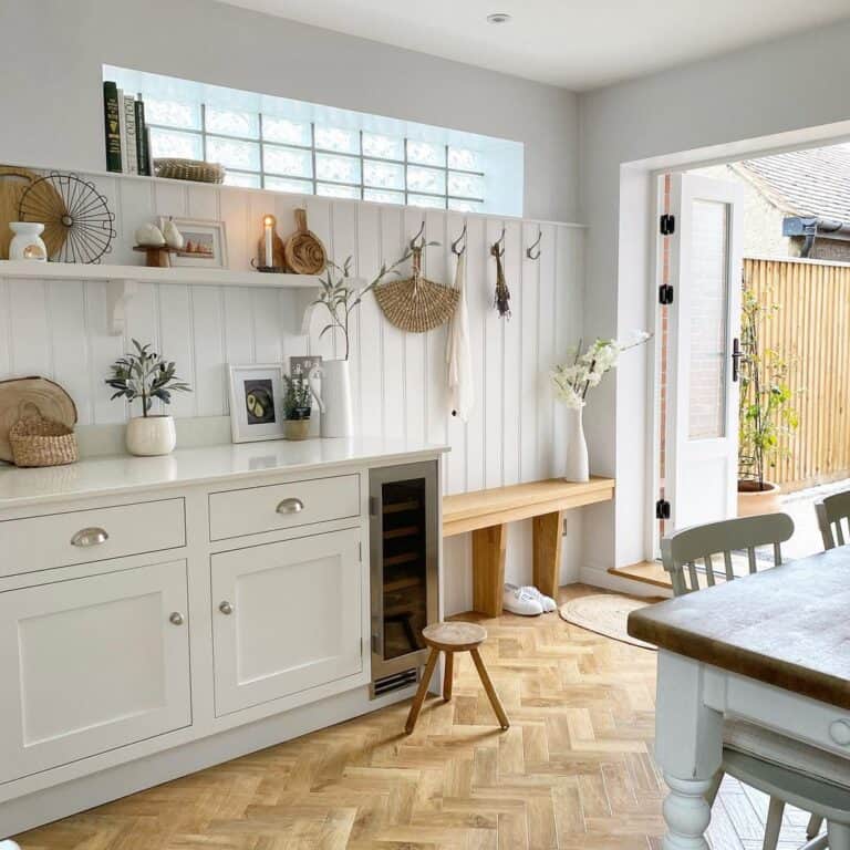 White Kitchen with Light Herringbone Floors